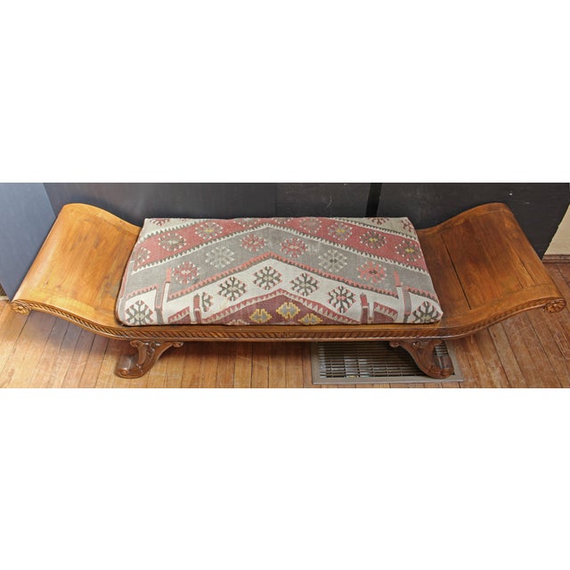 Anglo-Indian Regency Low Window Bench, circa 1820s-30s. Hand carved teak.Raised on cornucopia carved, scrolled legs....