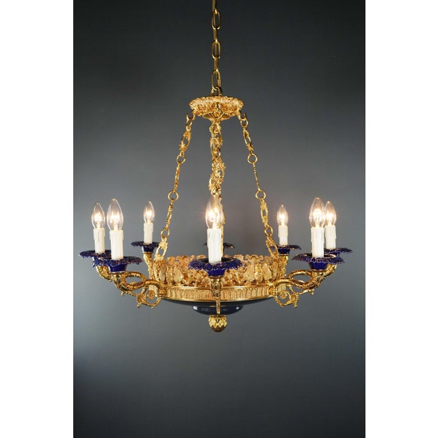 Introducing a stunning brass baroque empire chandelier reminiscent of the classic style of the empire era. This is a new...