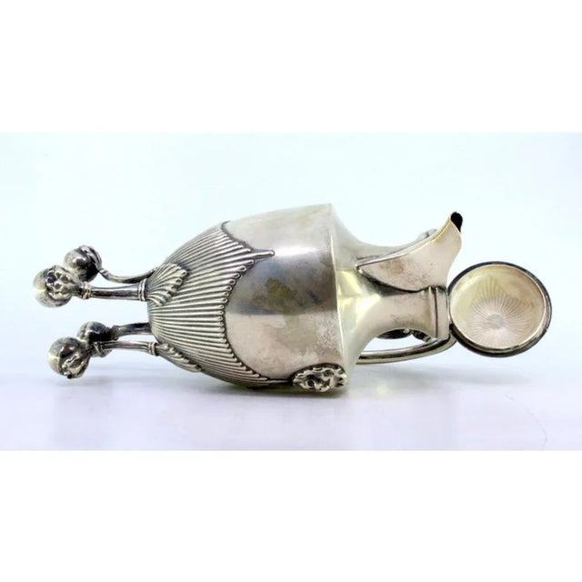 Silver Coffee Pot with Fluted Body, Lion Figure and Claw-Shaped Feet, in Very Good conditions. Designed 1890 to 1919 This...