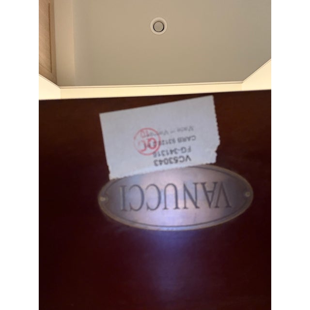 Vanucci Eclectics Console Table features three shelves and a clean, contemporary design. Pretty wood grain with capped...