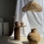 Small Indonesian brutalist terracotta pedestal pot. Height: 13cm; Diameter: 15cm; Base diameter: 9cm; Neck diameter: 9cm;...