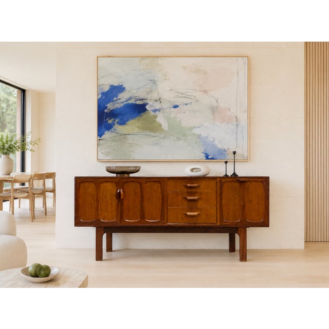 Mid Century Modern Teak Credenza by G-Plan, Made in England, c. 1960’s. This stunning piece combines generous storage with...