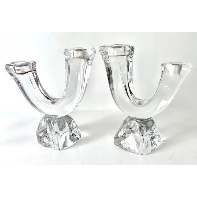 A Pair of Modern and organic crystal chandeliers from Paris France. The pair are a stunning match to any table or cocktail...