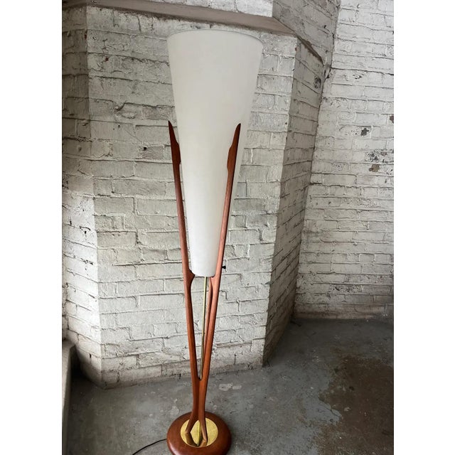 Sculptural Modeline floor lamp from the 1960s with a solid walnut frame, brass accent base, and original textured conical...