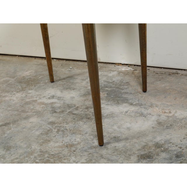 An Italian brass coffee table from the mid 20th century, with marble top and tapered legs. Created in Italy during the...
