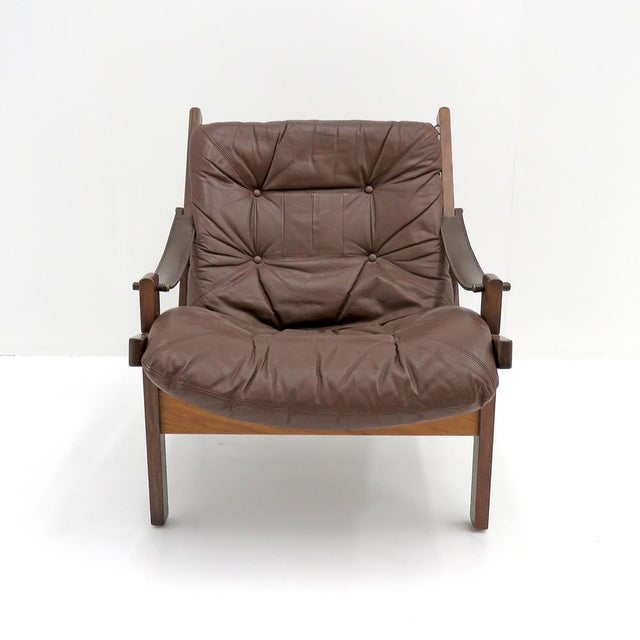 wonderful leather arm chairs designed by Torbjørn Afdal for Bruksbo, Norway, 1960, with chocolate brown leather and...