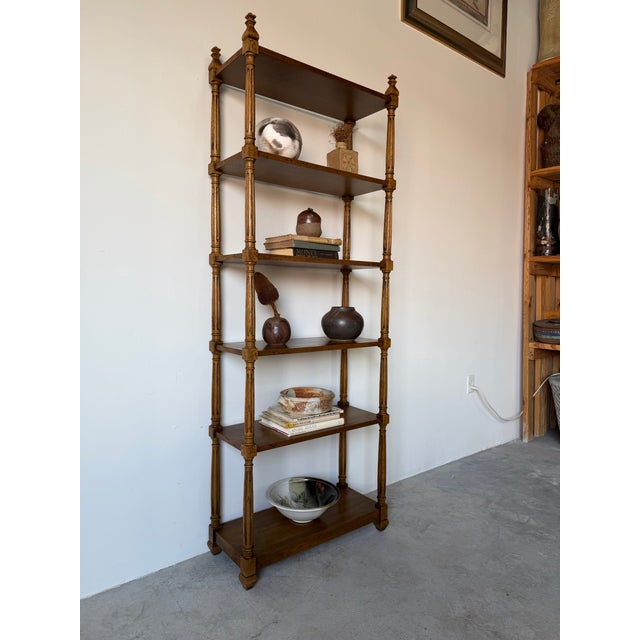 Elegant vintage Hollywood Regency–style étagère by Heritage Furniture, crafted from solid walnut with a rich warm finish....