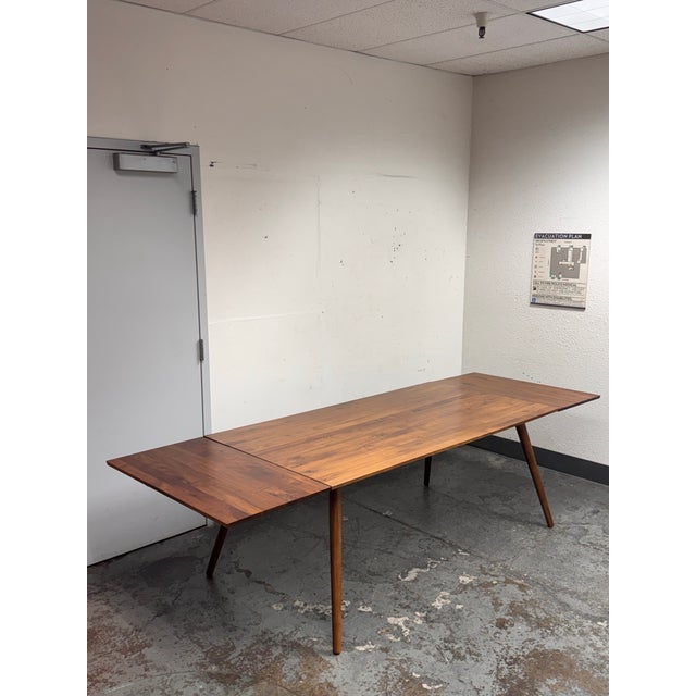Design Plus Gallery presents the Extendable Seno Walnut Dining Table from Article. This walnut table pairs a streamlined...