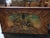 A charming mid-19th century Alpine blanket chest crafted from pine and richly decorated with hand-painted folk art panels...