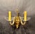 Elegant pair of Murano-style two-light wall sconces crafted in Czechoslovakia, each stamped “Made in Czechoslov.” — a mark...