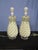 Stunning Pair of Ceramic Lamps on a Lucite base. The Pair have exceptional detail, white glaze and drum shades . The Pair...