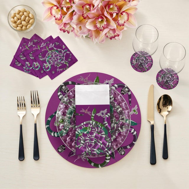 Let your table transition from classic to modern with our Ouroboros Vegan Leather Round Pebble Placemat, featuring an...