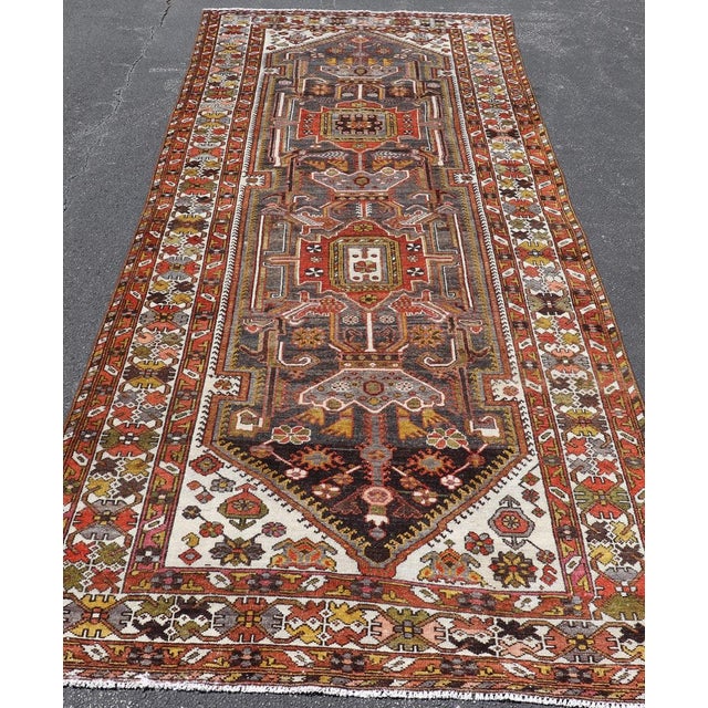 Early 20th Century Antique Persian Bakhtiar Gallery Rug Featuring a Multi-Medallion Tribal Design For Sale - Image 5 of 16