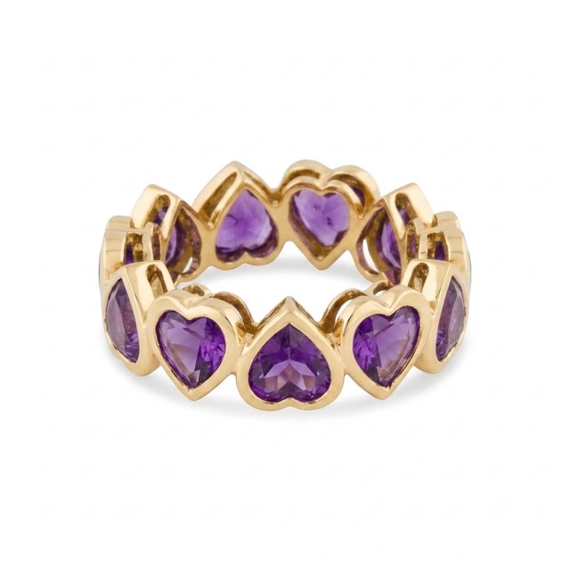 Add a touch of regal romance to your collection with the captivating eternity band. This striking ring features a...