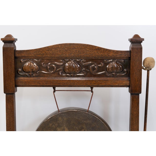 Arts & Crafts Movement oak floor standing dinner gong with stylised sinuous copper panel. Attributed to Shapland And...
