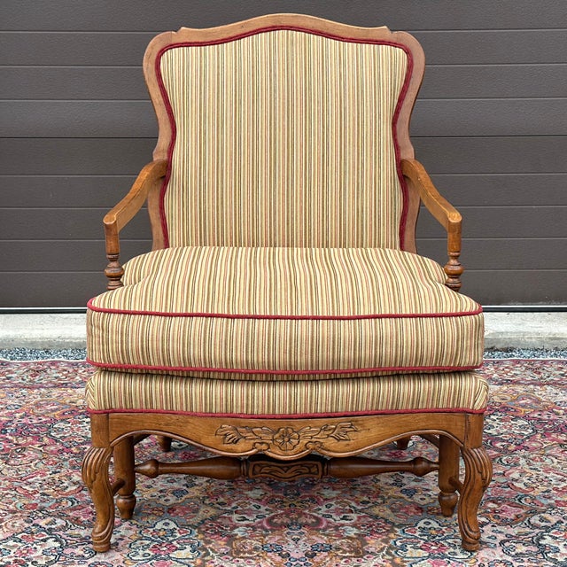 Highland House Genevieve French Country Bergere Lounge Chair featuring a shapely hand carved fruitwood frame with curved...