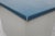 Gispen 'Kleuro' line industrial office desk with a blue linoleum writing surface, three blue-enameled drawer fronts, and a...