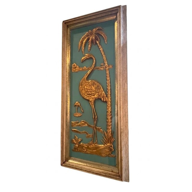 Vintage 1950s Metalcraft shadow box wall art featuring a gold-tone dimensional flamingo and palm tree scene against a...