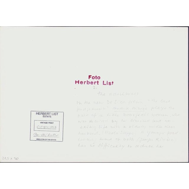 Herbert List – Film Still – Anouk Aimée, 1961 – Vintage Print This striking vintage film still by Herbert List captures...