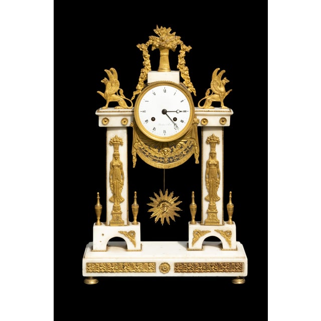 Bronze and marble mantel clock from 18th century signed De Bontems a Pairs: Measures: 13.5" x 4.5" x 21.5" Weighs: 23