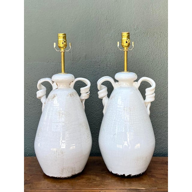 This striking pair of vintage ceramic table lamps captures the perfect balance of sophisticated Mediterranean form and...