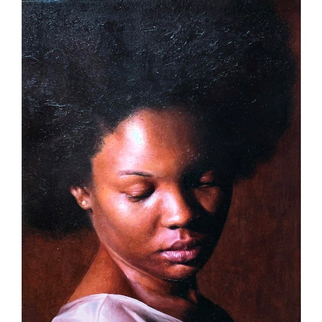 The painting "Warmth" presents a serene portrait of a woman, her head slightly bowed, exuding a sense of introspection and...
