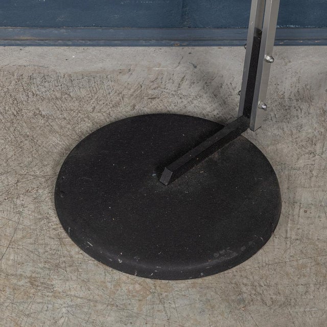 An elegant arc floor lamp from Italy, circa 1970s, featuring a harmonious blend of materials that exemplify timeless...