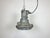 Industrial factory hanging lamp made in former Czechoslovakia during the 1960s. It features a cast aluminium body and a...
