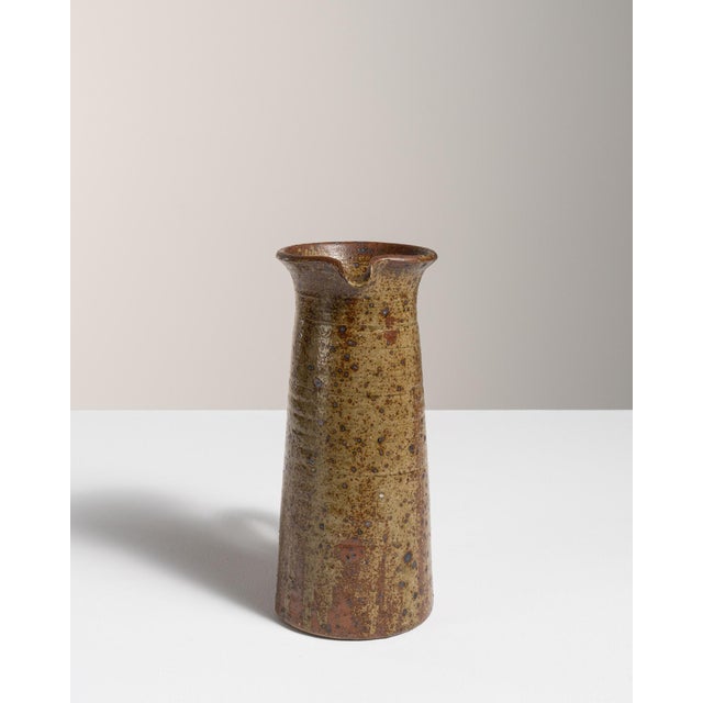 A jar in ceramic, hand-finished in the 1970s in Belgium. The glaze and form reflect the artisanal ceramic traditions of...