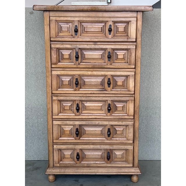 20th century Catalan Spanish carved oak chest of drawers, highboy or console Country Provincial Chiffoniere was fashioned...