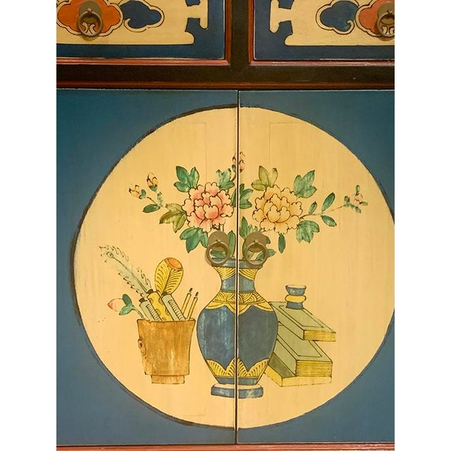 Asian Mongolian Cabinet is made out of elm wood. It has 2 doors and 2 drawers with 1 removable shelf. This cabinet is all...