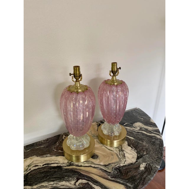 A pair of Murano ballerina pink table lamps. They have been professionally refinished and rewired, so they are in...