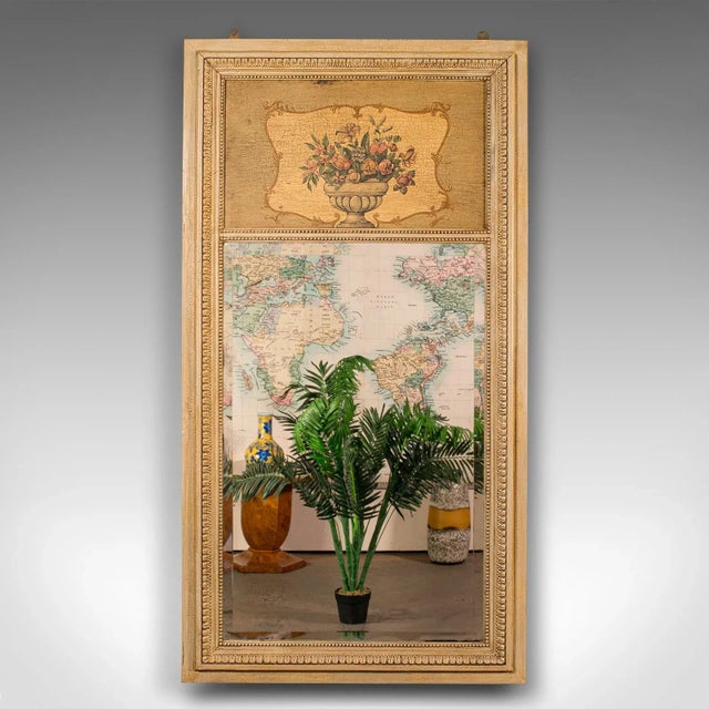 This is a tall antique trumeau mirror. A French, painted provincial pier or wall mirror, dating to the late Victorian...