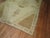 Turkish Kars in browns and khaki with an elegant open field central medallion design. 6'7'' x 10'2''