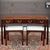 A vintage Tradition House Chippendale solid cherry 3 drawer console table with pair of benches featuring a serpentine...