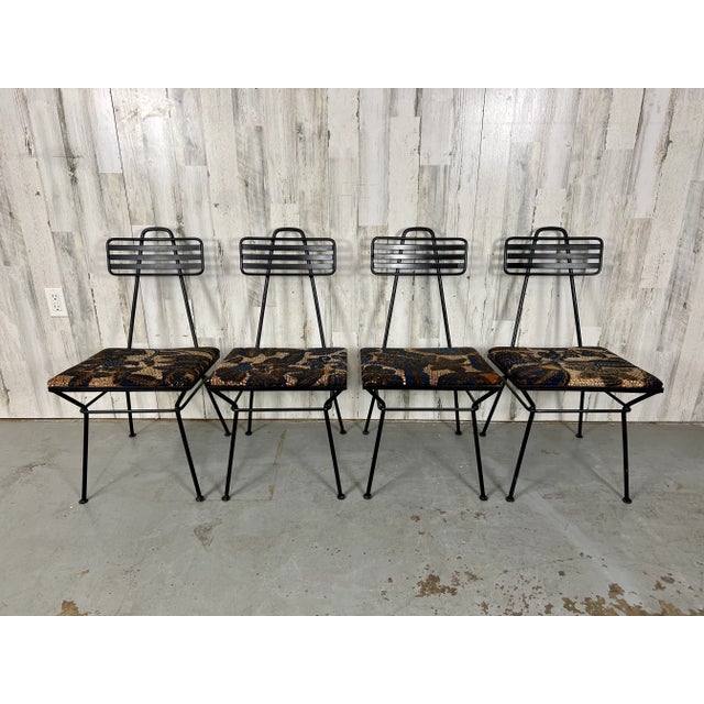 Rare set of four "Pasadena" Iron dining chairs by Polly of California. Architechual design makes these very dramatic for...