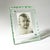 A tabletop photo frame from the 1960s, made entirely of transparent glass. Its most distinctive feature is the large outer...
