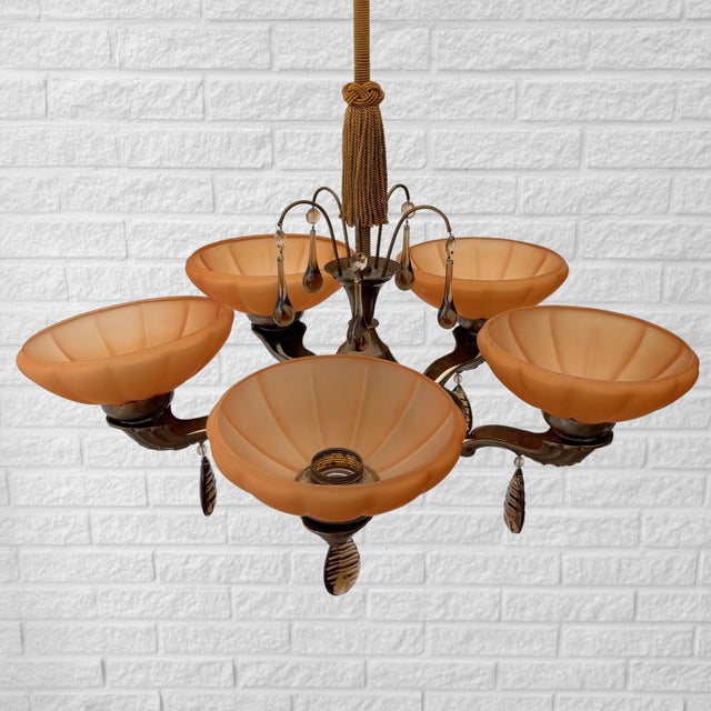 A graceful Swedish Modern chandelier produced by an unidentified manufacturer in the 1930s. Elegant in both form and...