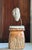 A compelling carved stone face, mounted on a custom welded steel base. Of Indonesian origin, circa 1970s, the sculpture...