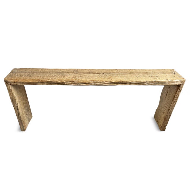 Farmhouse vintage elm wood console entry table with simple waterfall design. This sturdy table has a weathered finish with...