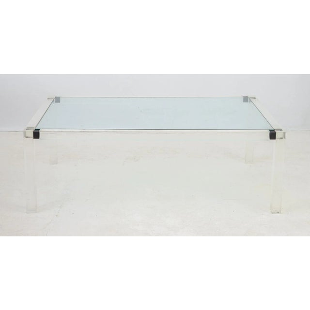 Mid-Century Modern Glass Top Lucite Coffee Table, 1970s, with leather details at corners. 18" H x 53.5" W x 36" D....