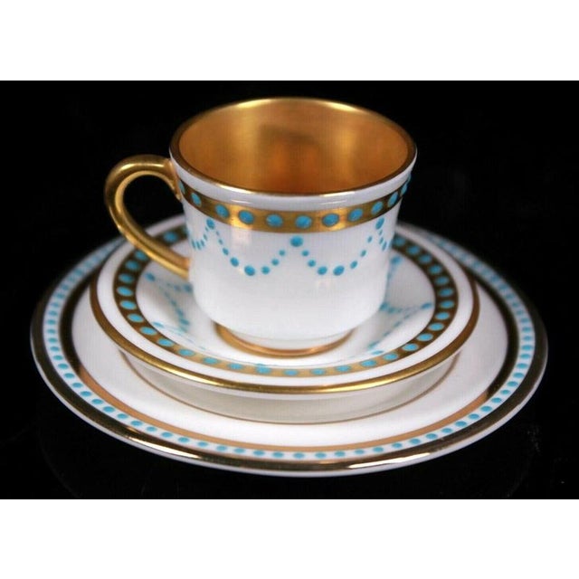 Raised turquoise enamel beads accent this miniature porcelain cabinet trio, arranged in delicate swags and concentric...