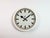 This wall clock was produced by Siemens in Germany during the 1950s. It features a white (beige) metal frame, a metal dial...