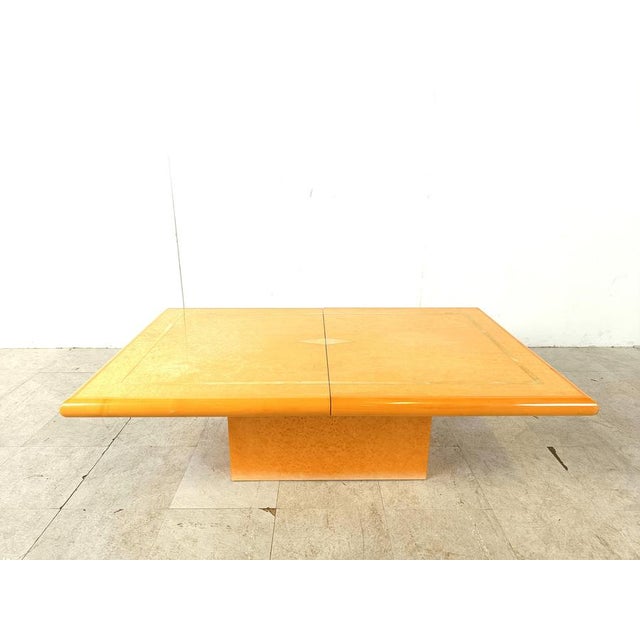 Exquisite wooden coffee table by Eric Maville. This luxurious coffee table slides open to reveal a mirrored storage space...