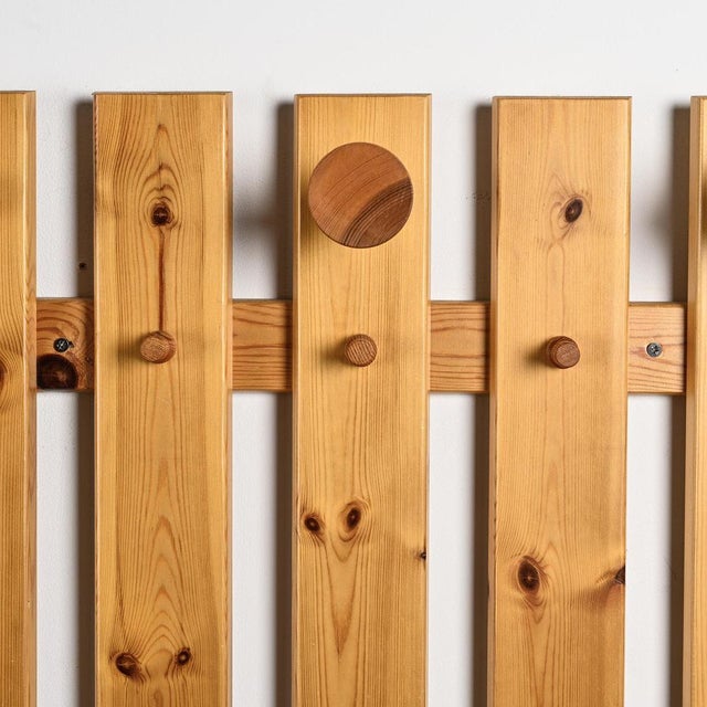 Wall-mounted coat rack in solid pine from the La Plagne ski resort, 1970s. Composed of vertical slats connected by...