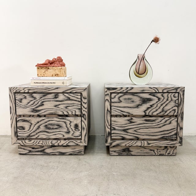 Pair of Vintage Nightstands Featuring Ettore Sottsass Veneer This pair of vintage nightstands has been re-veneered in the...