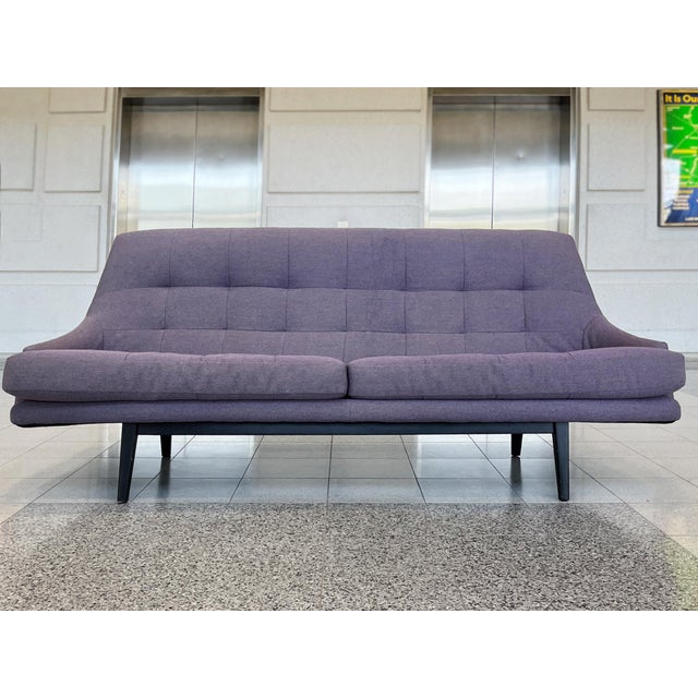 Originally crafted in the 1960s, this cozy Danish Modern sofa was later reupholstered in a gray lavender linen, with...