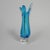 This vase is constructed, from bottom to top, from a triangular transparent base, a blue base, and 3 blue "tongues" at the...