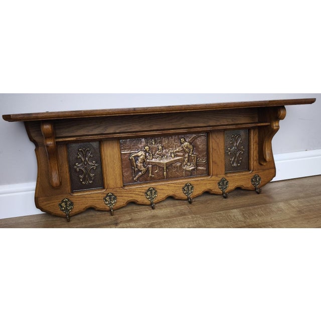An exceptional Vintage French coat hanger, beautifully combining traditional craftsmanship with decorative artistry,...