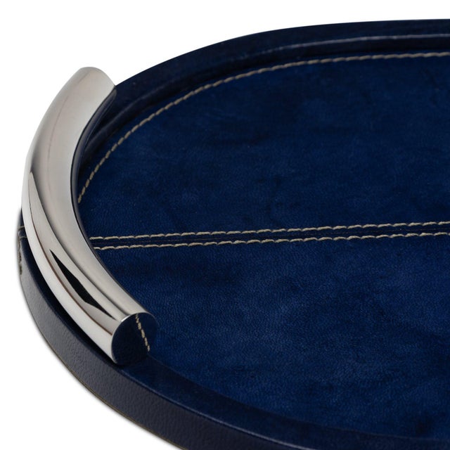 Genuine deep blue leather with contrast stitching and plated metal handles is refined luxury. Whether serving cocktails or...
